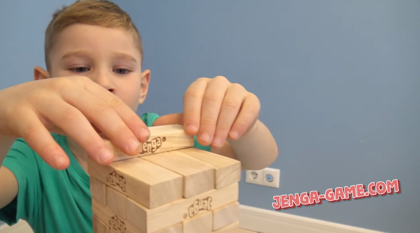 Boy is playing Jenga Game